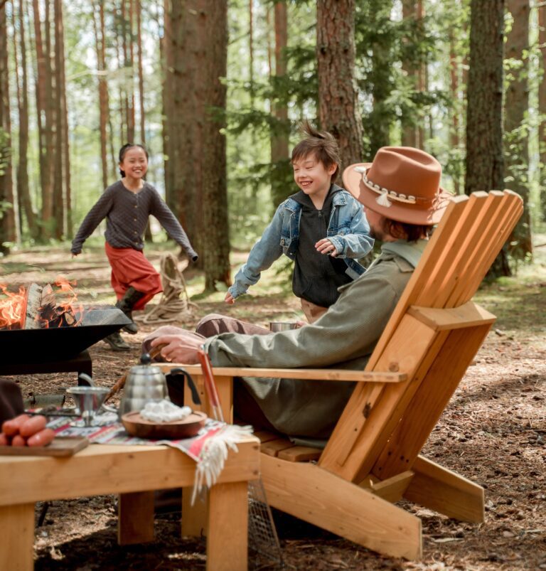 A happy family having fun around the campfire.