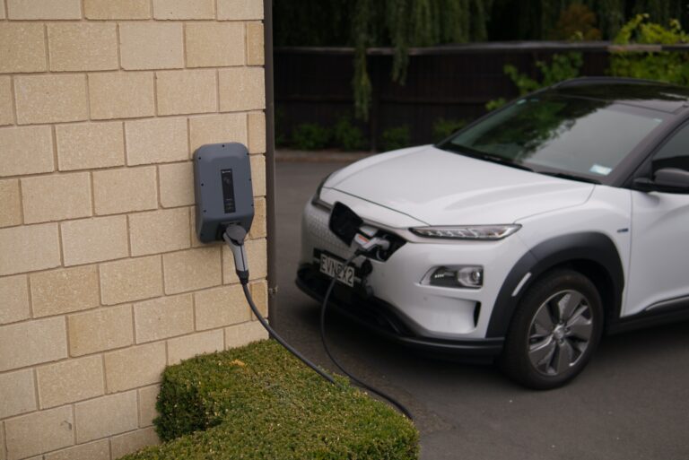 An electric vehicle being charged with a portable EV Charger.