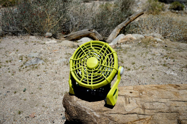 A portable camping fan on outdoors.