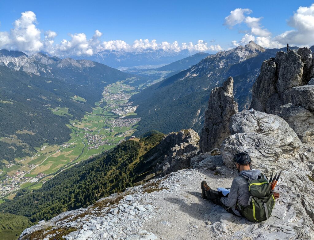 Man resting after a hike while primitive camping